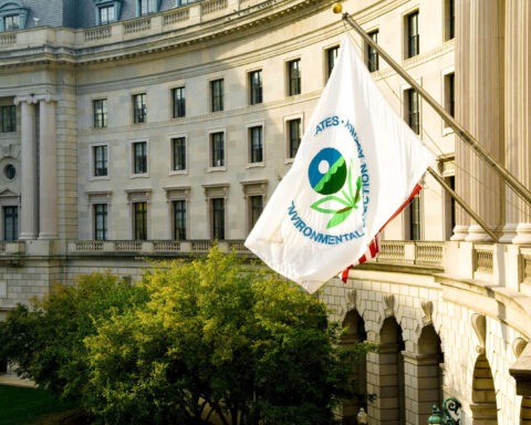 an EPA flag waves in front of the federal building