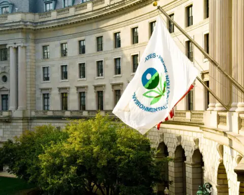 an EPA flag waves in front of the federal building