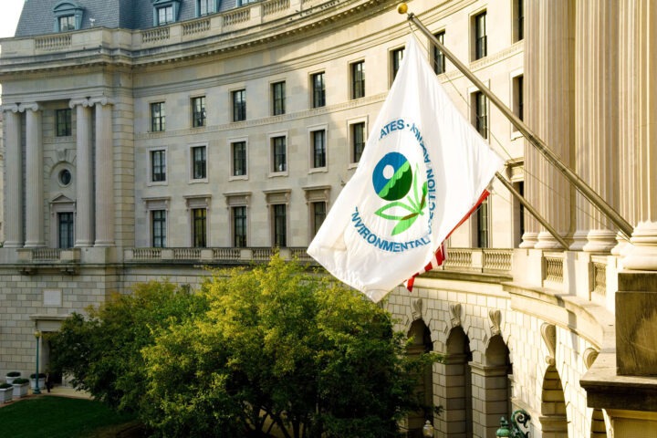 an EPA flag waves in front of the federal building