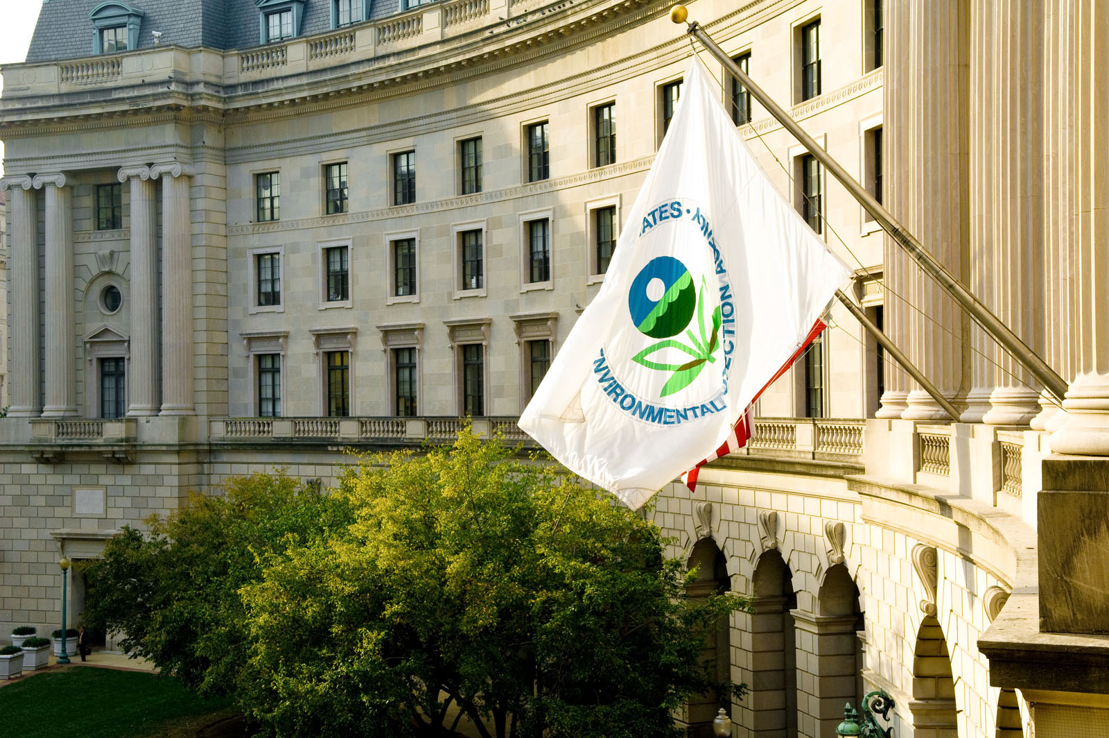 an EPA flag waves in front of the federal building