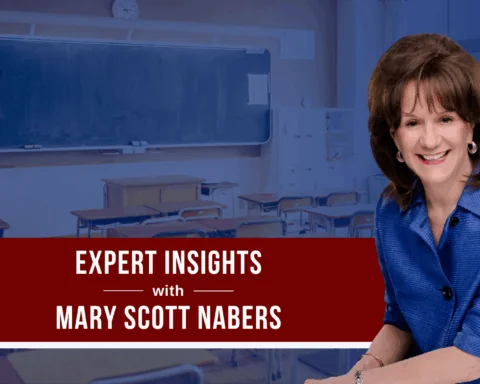 mary scott nabers smiles for a professional headshot in front of a blue graphic showcasing a classroom