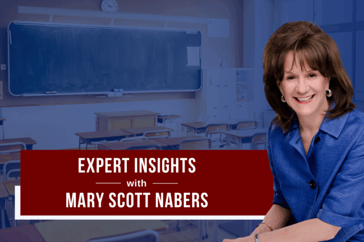 mary scott nabers smiles for a professional headshot in front of a blue graphic showcasing a classroom