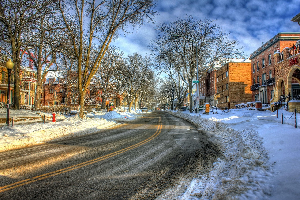 A snow-dusted road is without cars or traffic in a Wisconsin town.