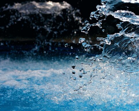 Water splashes upwards in a natural body of water.