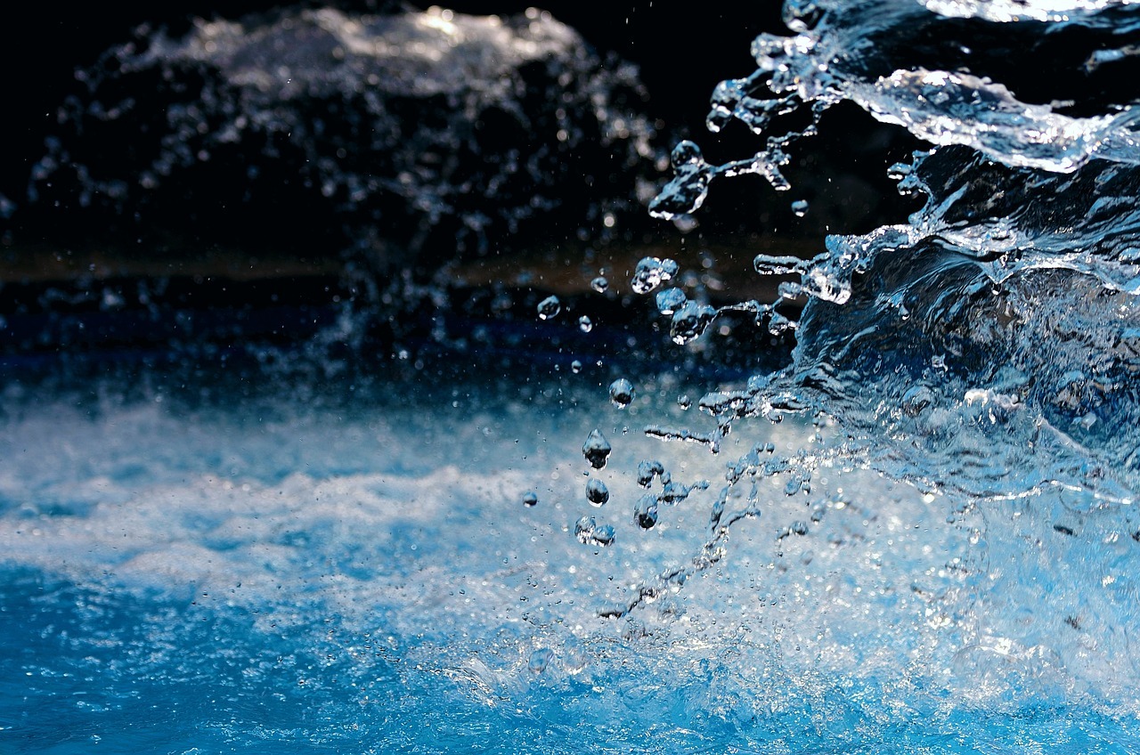 Water splashes upwards in a natural body of water.