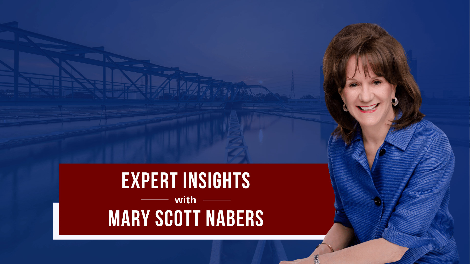 Mary Scott Nabers is imposed over a bridge carrying traffic over a body of water.