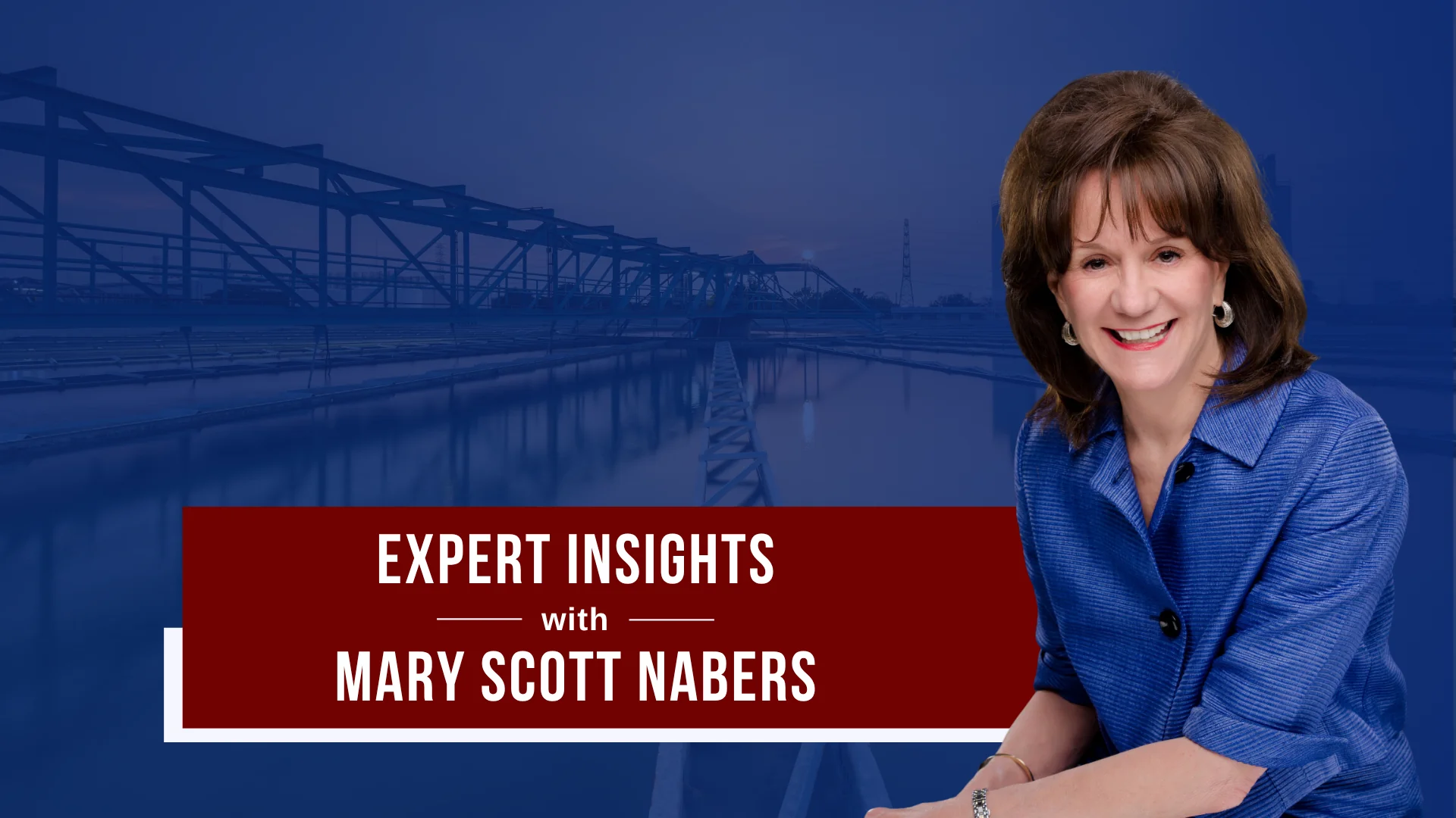 Mary Scott Nabers is imposed over a bridge carrying traffic over a body of water.