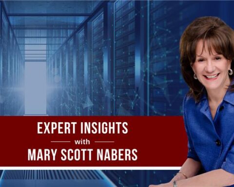 mary scott nabers smiles in front of a blue graphic with data storage