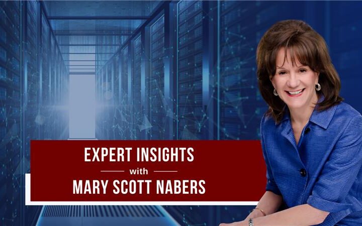 mary scott nabers smiles in front of a blue graphic with data storage