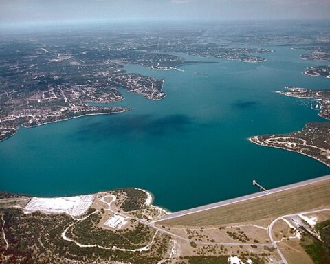 Aerial view of Canyon Lake and Dam on the Guadalupe River in Comal County, Texas, USA. The dam was completed in 1964 by the U.S. Army Corps of Engineers for flood control and water supply. The dam, lake, and all adjacent property are managed by the Guadalupe-Blanco River Authority. View is to the west.