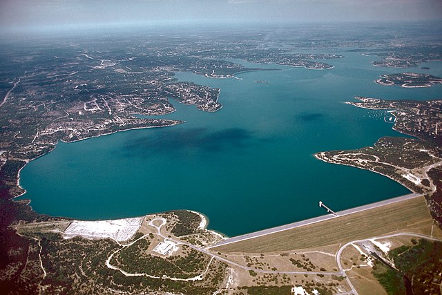 Aerial view of Canyon Lake and Dam on the Guadalupe River in Comal County, Texas, USA. The dam was completed in 1964 by the U.S. Army Corps of Engineers for flood control and water supply. The dam, lake, and all adjacent property are managed by the Guadalupe-Blanco River Authority. View is to the west.