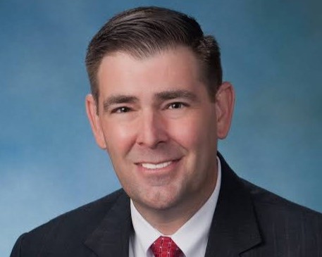 andy gipson smiles for a professional headshot