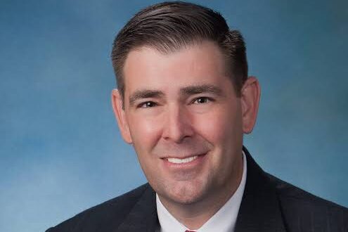 andy gipson smiles for a professional headshot