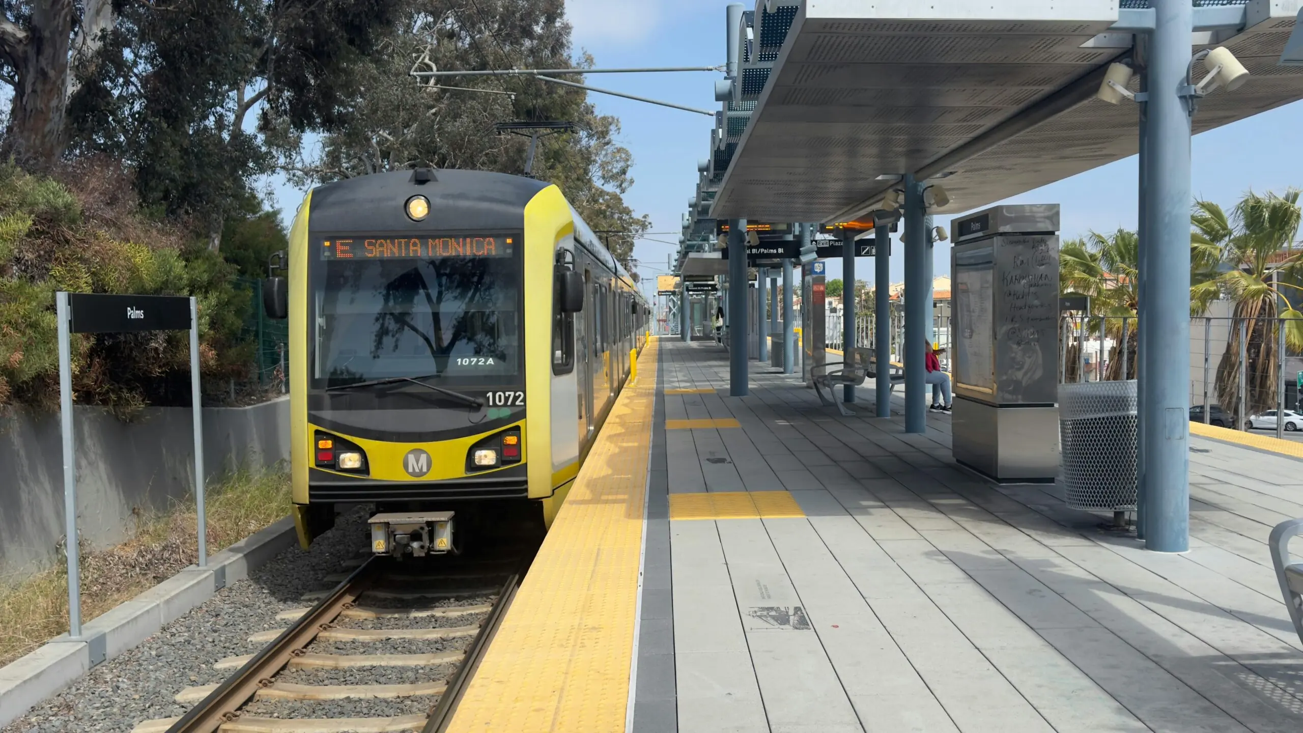 A LA Metro train headed to Santa Monica remains at a passenger platform in California.