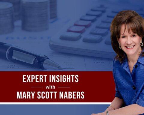 Mary Scott Nabers sits before an image of a pen and calculator.