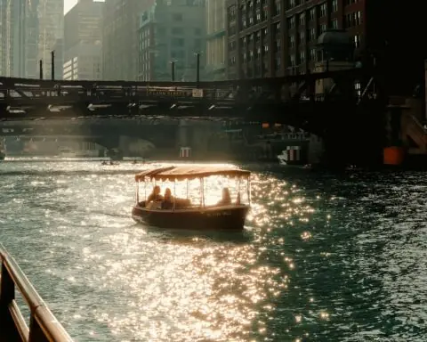 A boat travels down the river in Chicago.