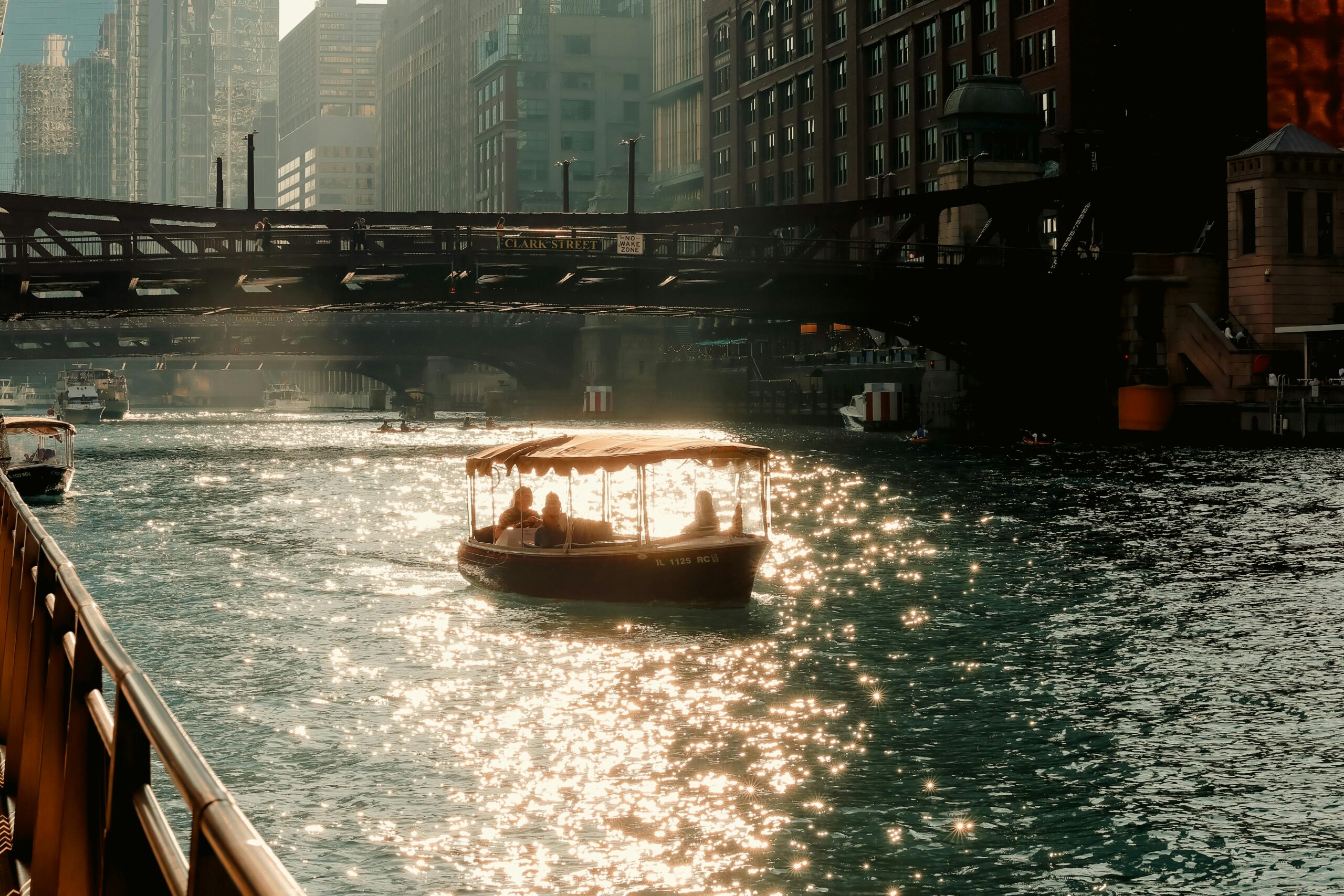 A boat travels down the river in Chicago.