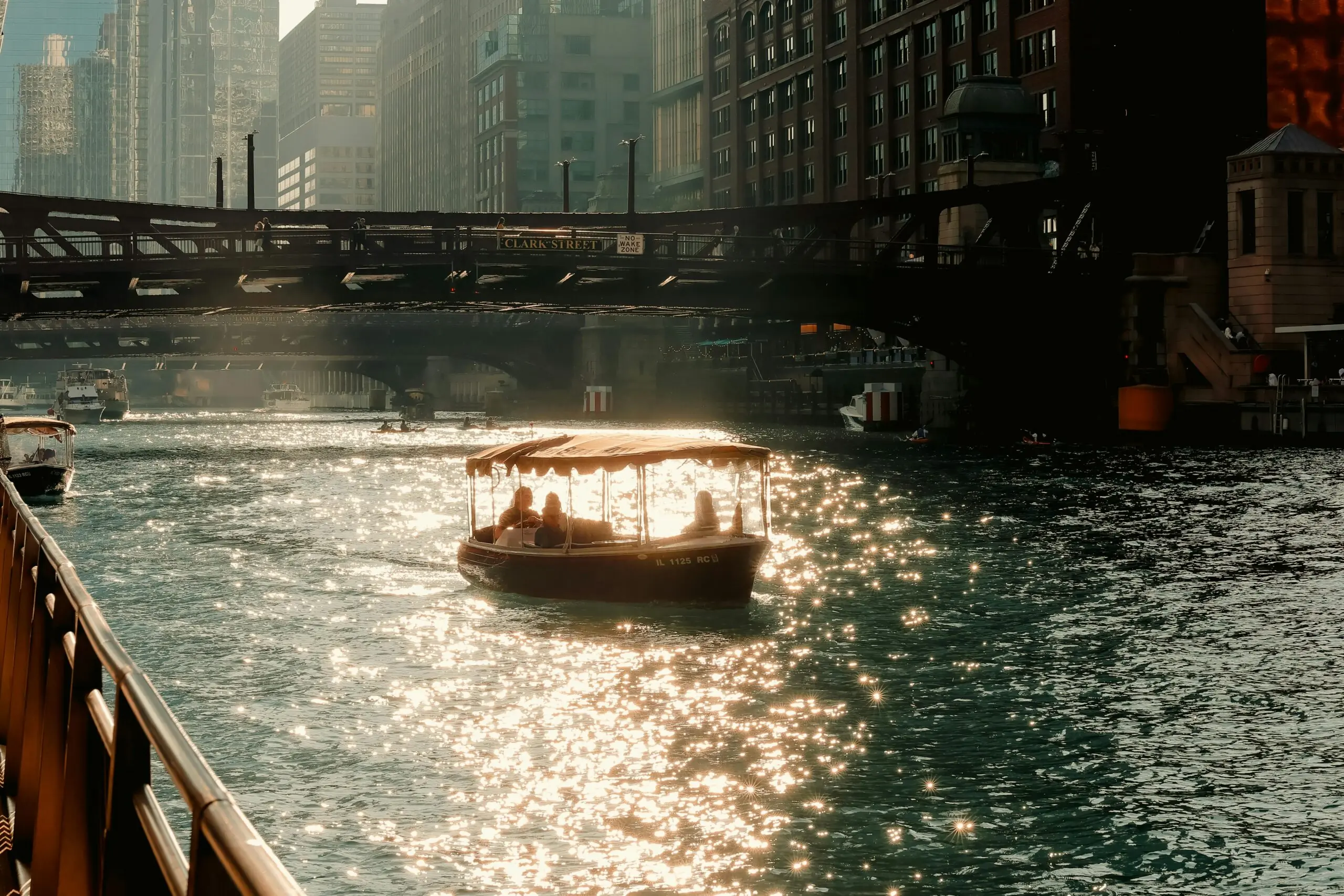 A boat travels down the river in Chicago.