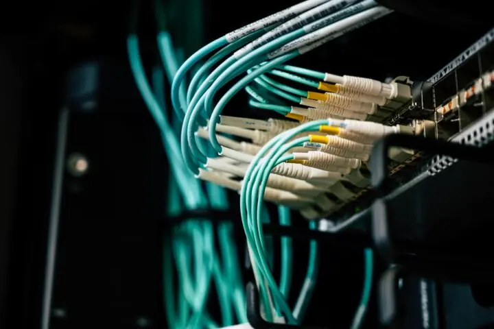 Internet cables connect to a device delivering broadband internet.
