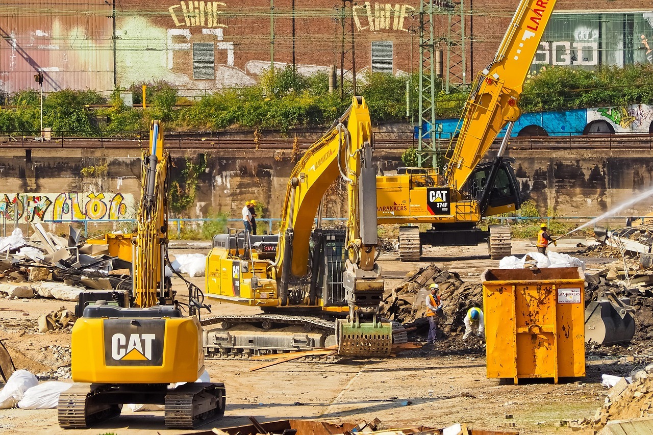 A construction site with construction vehicles, supporting ongoing capital efforts.