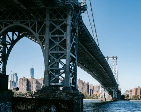 A large bridge spans across a large body of water.