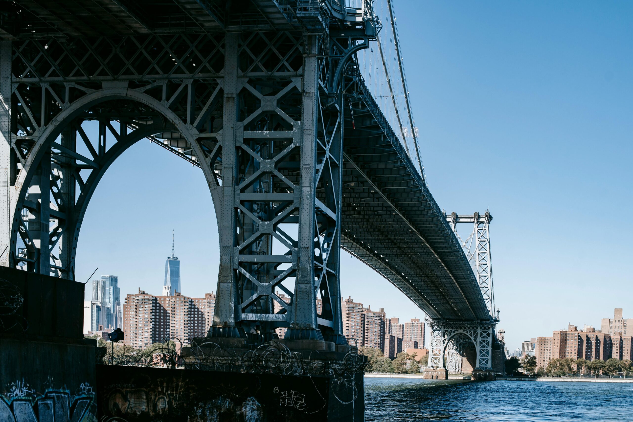 A large bridge spans across a large body of water.
