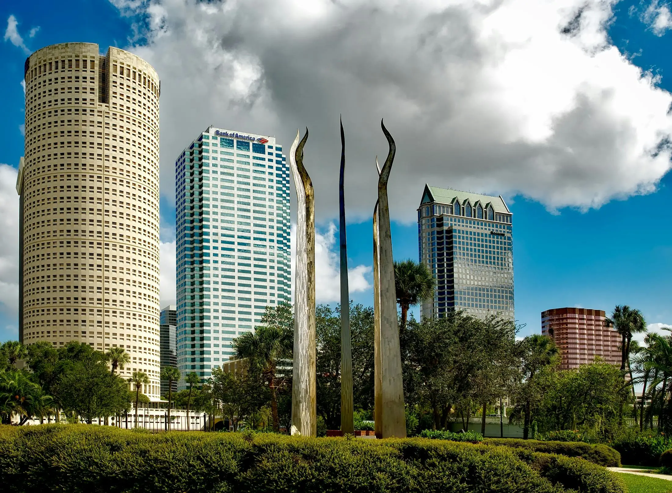 A sculpture in Tamp Bay, Florida stands before skyscrapers.