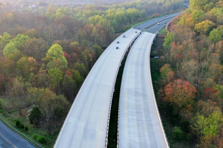A large highway cuts through trees over another highway in Maryland.