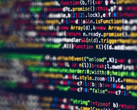 Code appears on a computer screen indicating a field that is increasingly affected by artificial intelligence.