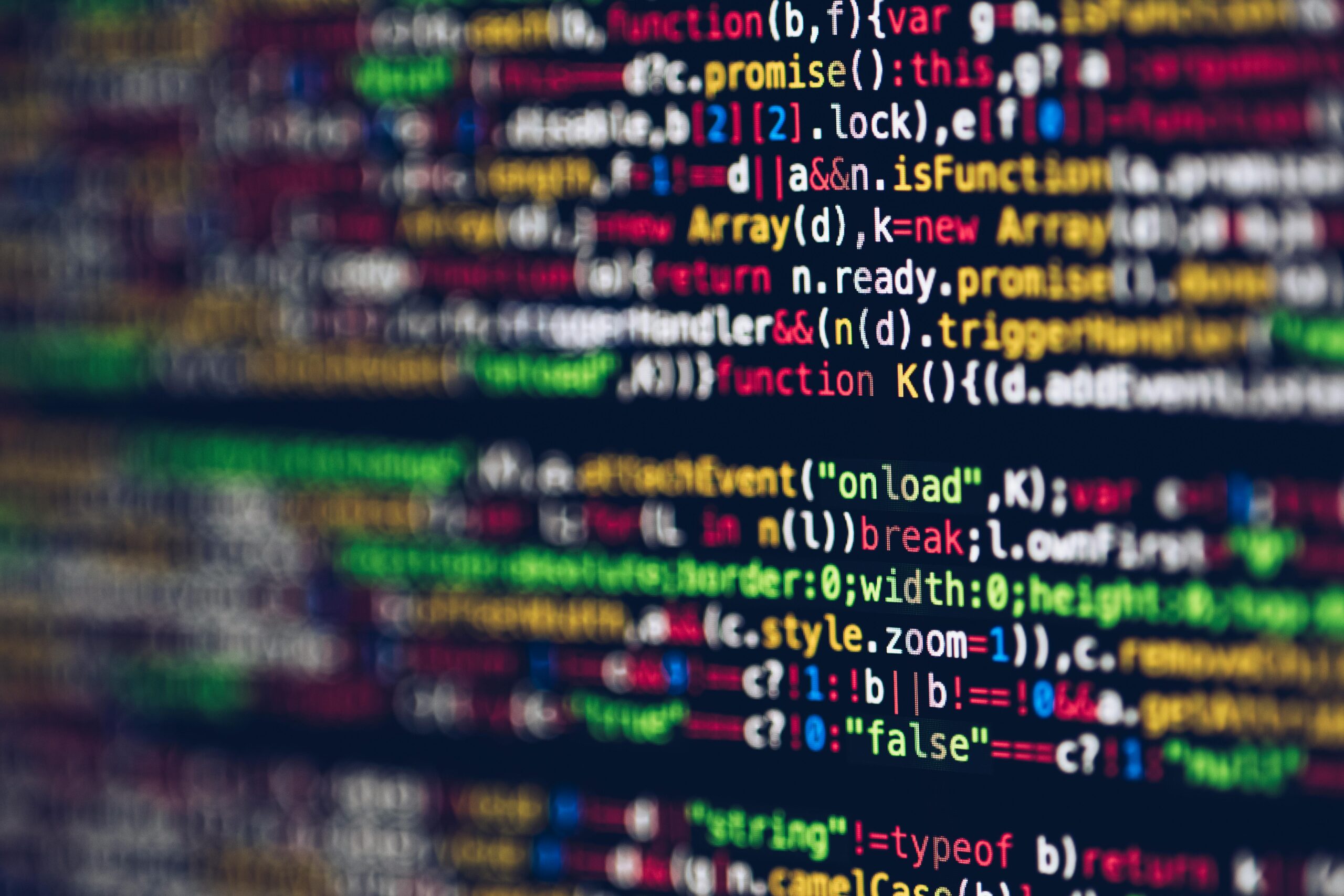 Code appears on a computer screen indicating a field that is increasingly affected by artificial intelligence.