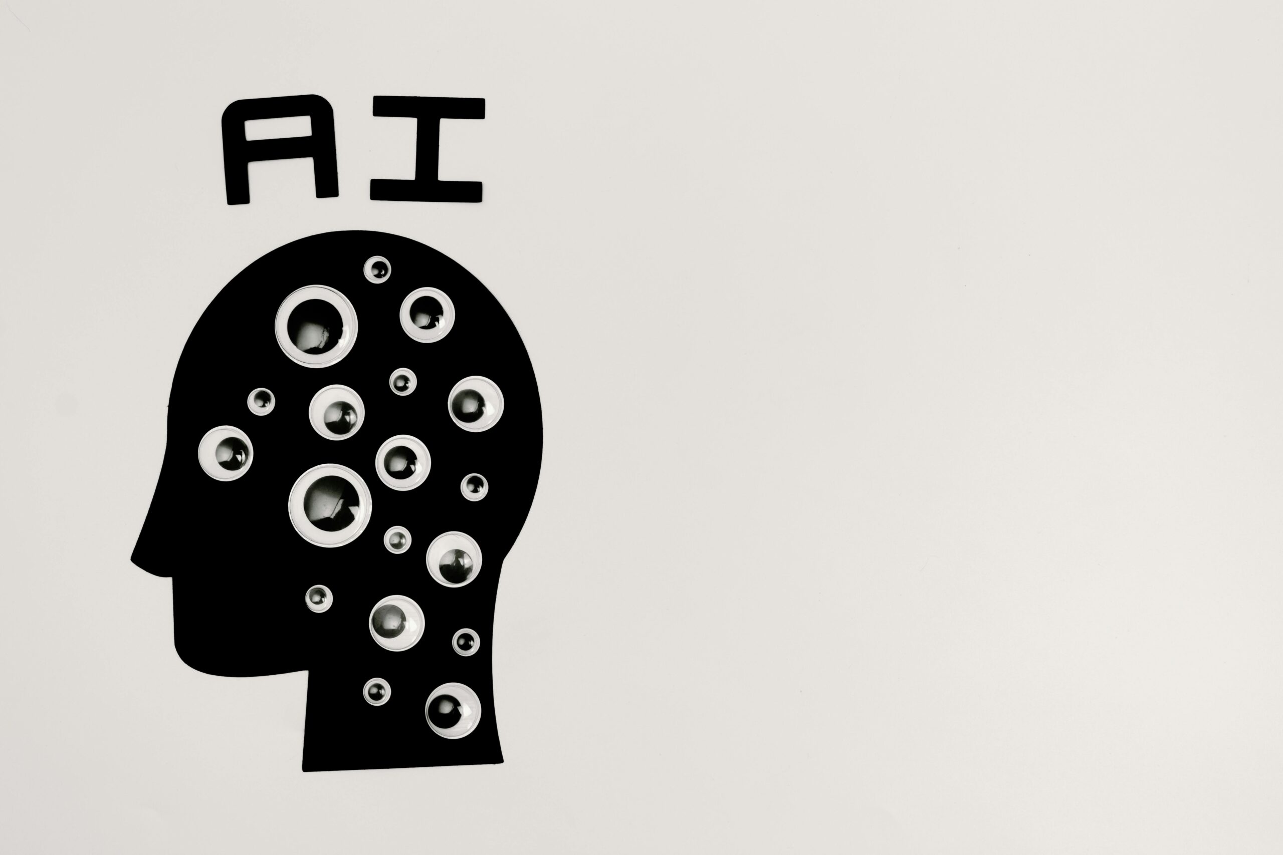 A rendering of a shadow head covered in eyeballs depicting artificial intelligence.