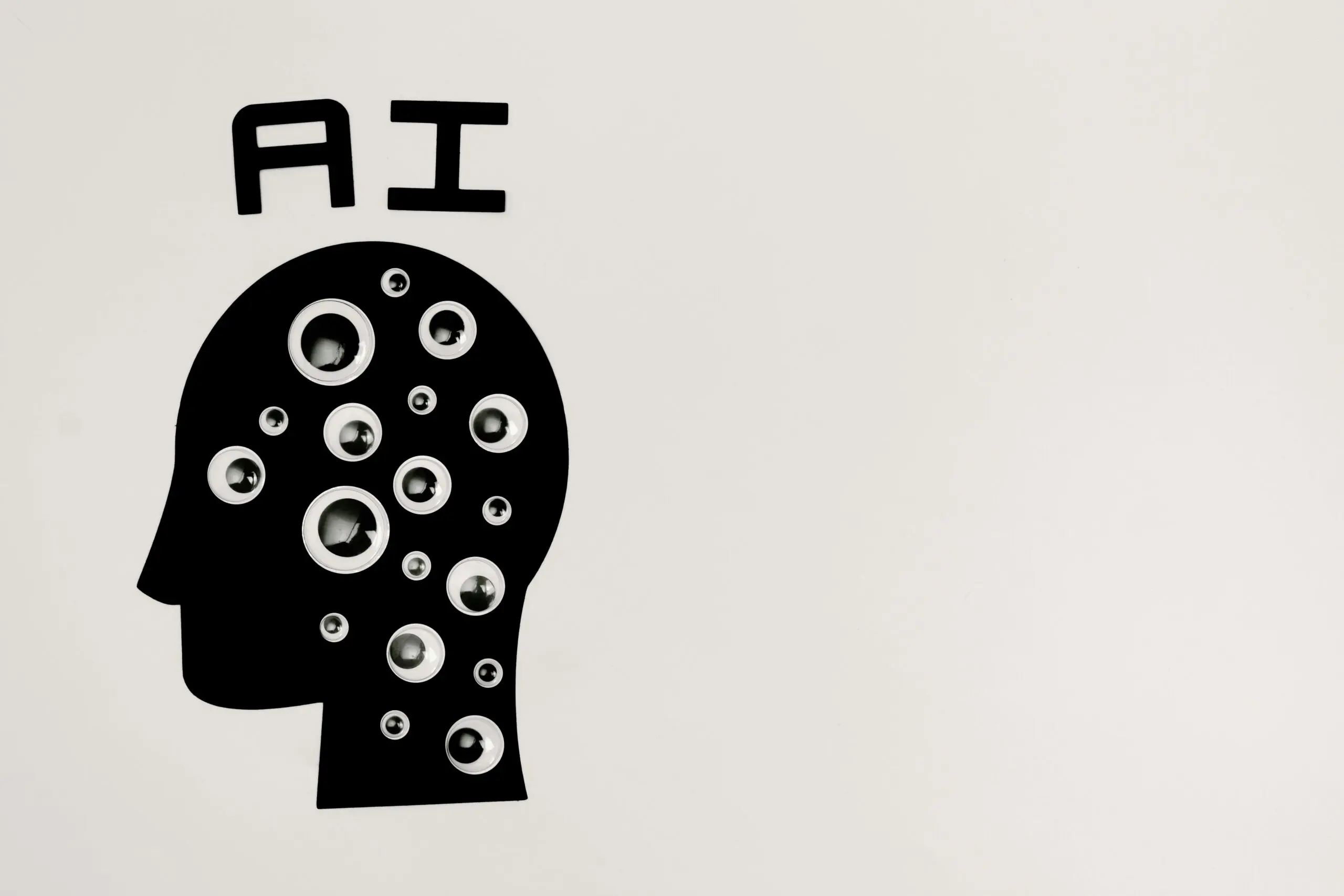 A rendering of a shadow head covered in eyeballs depicting artificial intelligence.