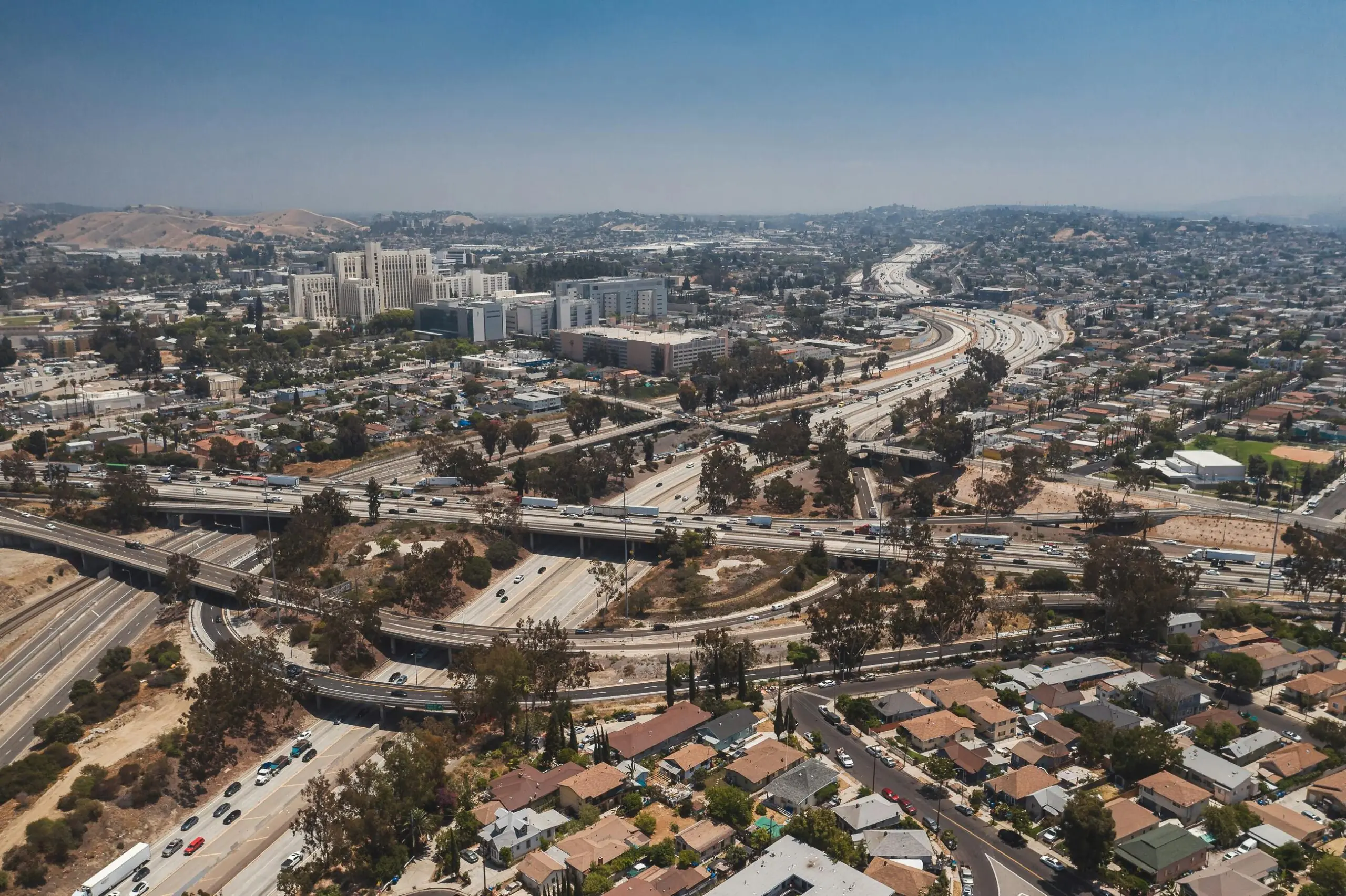 An aerial view of a California highway with intersecting roads and streets in Los Angeles.