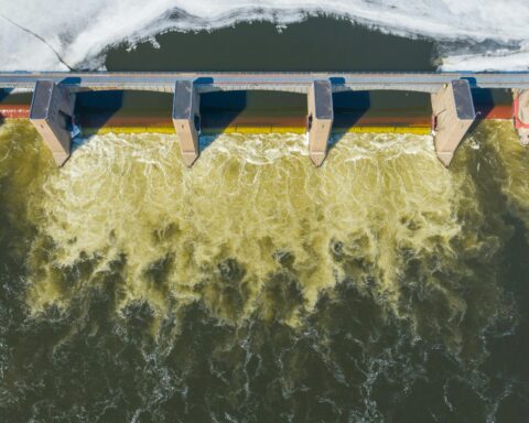 A dam or water break split water along a river.
