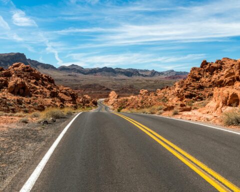 A long and winding highway in an American desert.