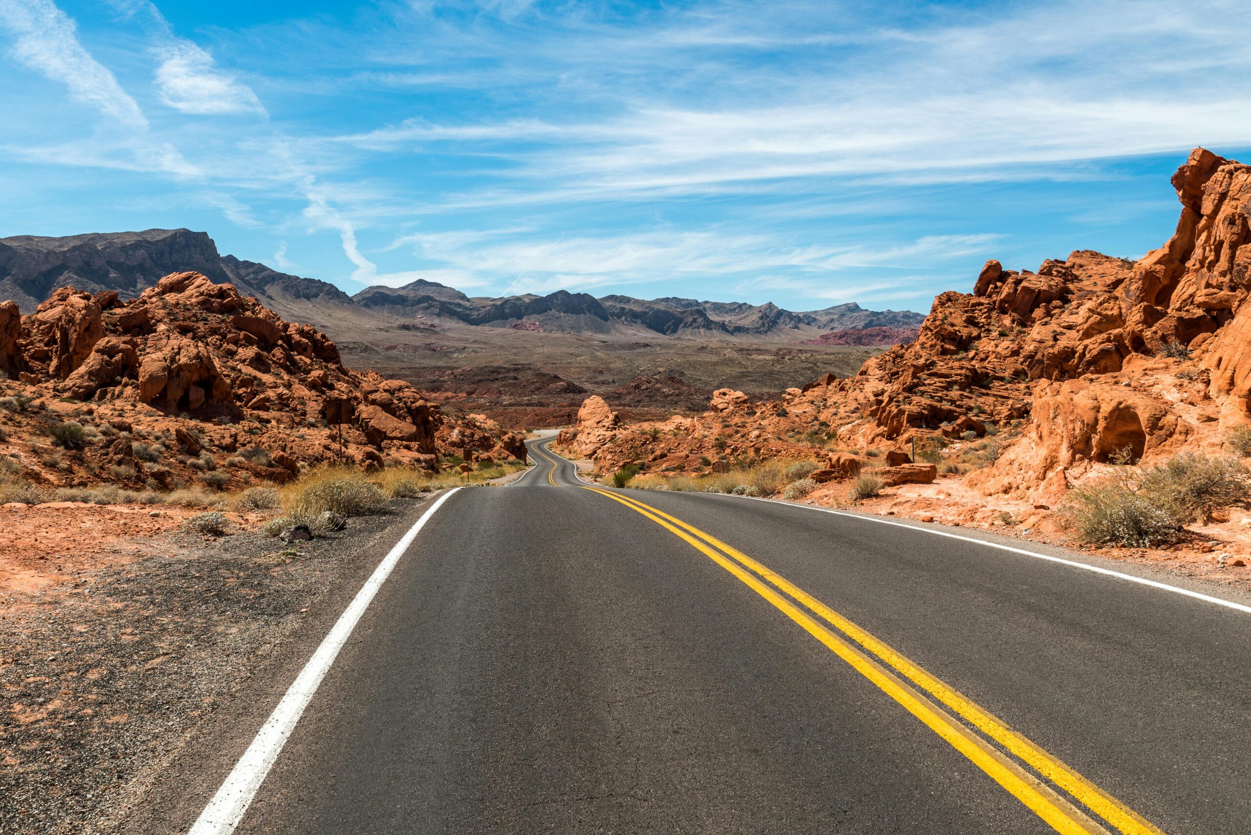 A long and winding highway in an American desert.
