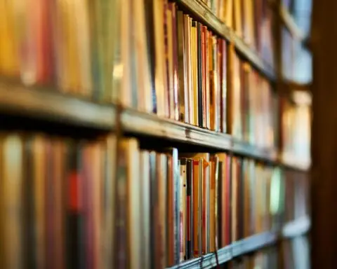 An array of books sit on shelves.