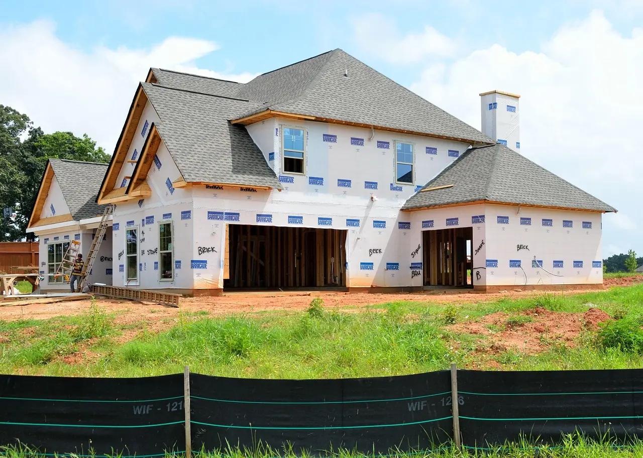 A nearly completed housing structure on a housing development.