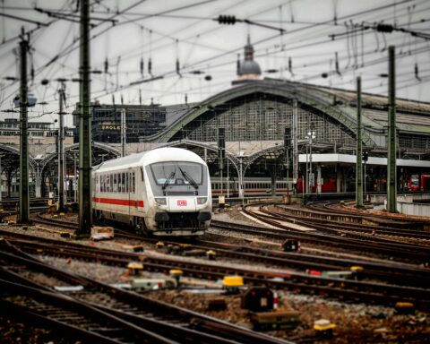 A train moves through a trainyard in Germany.