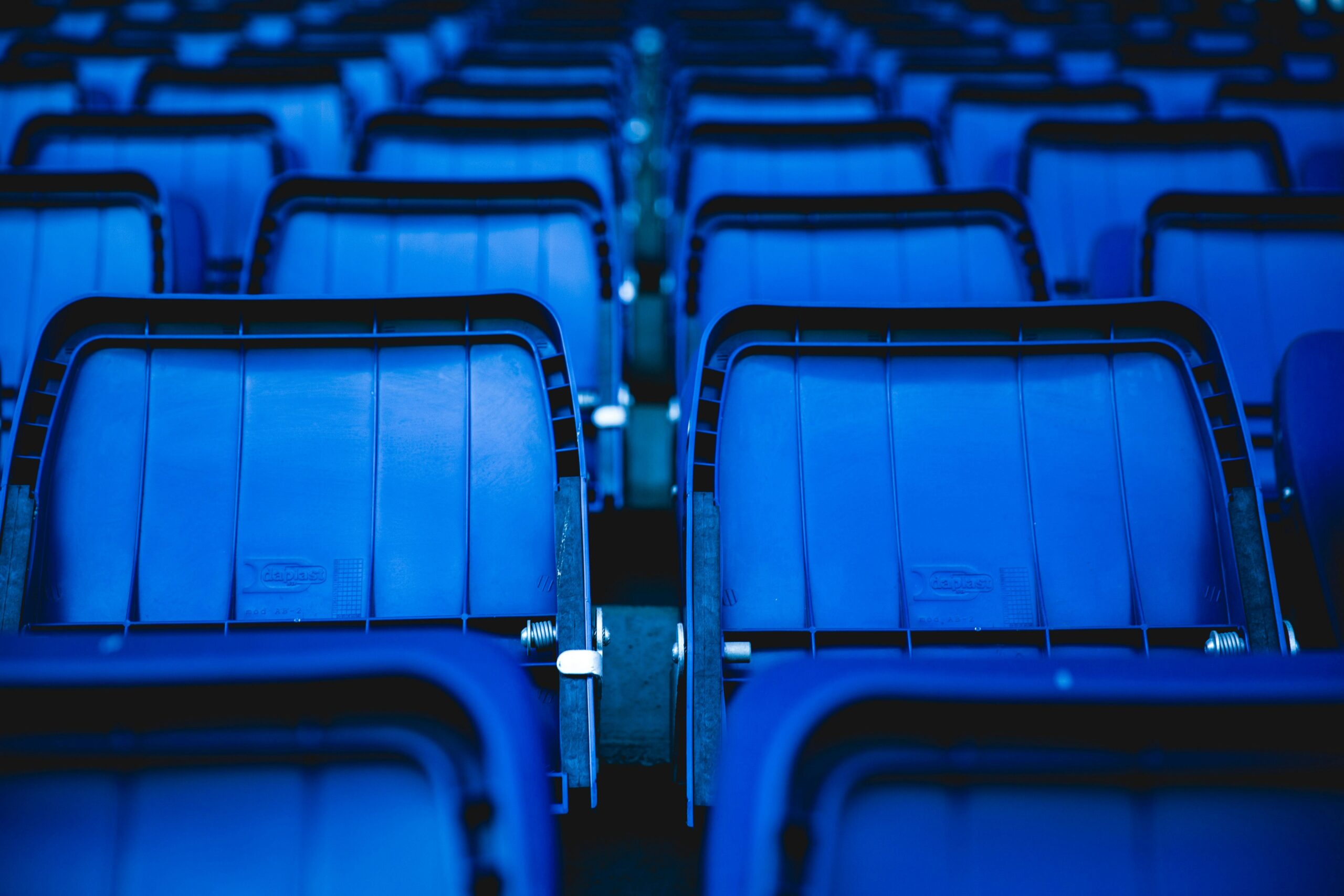 An assortment of blue stadium seats.