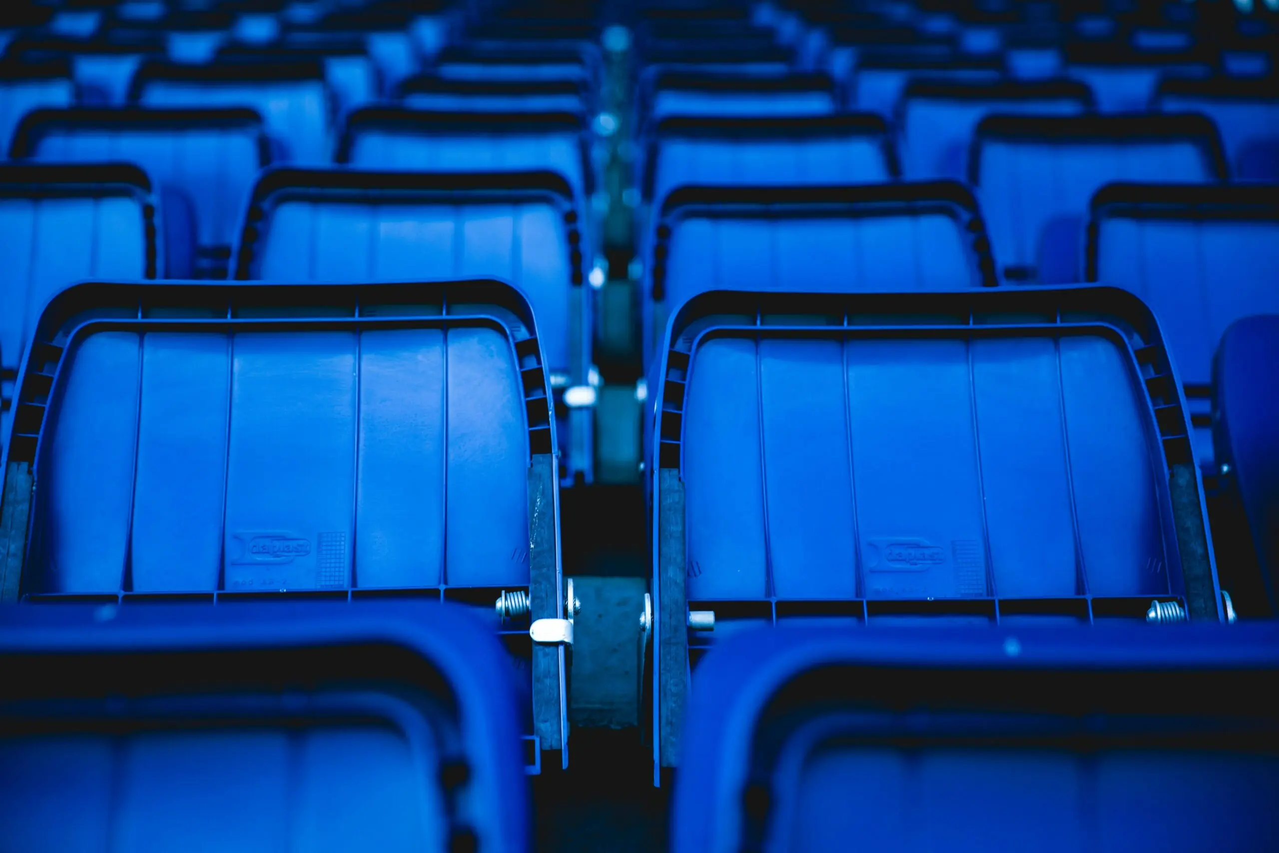 An assortment of blue stadium seats.