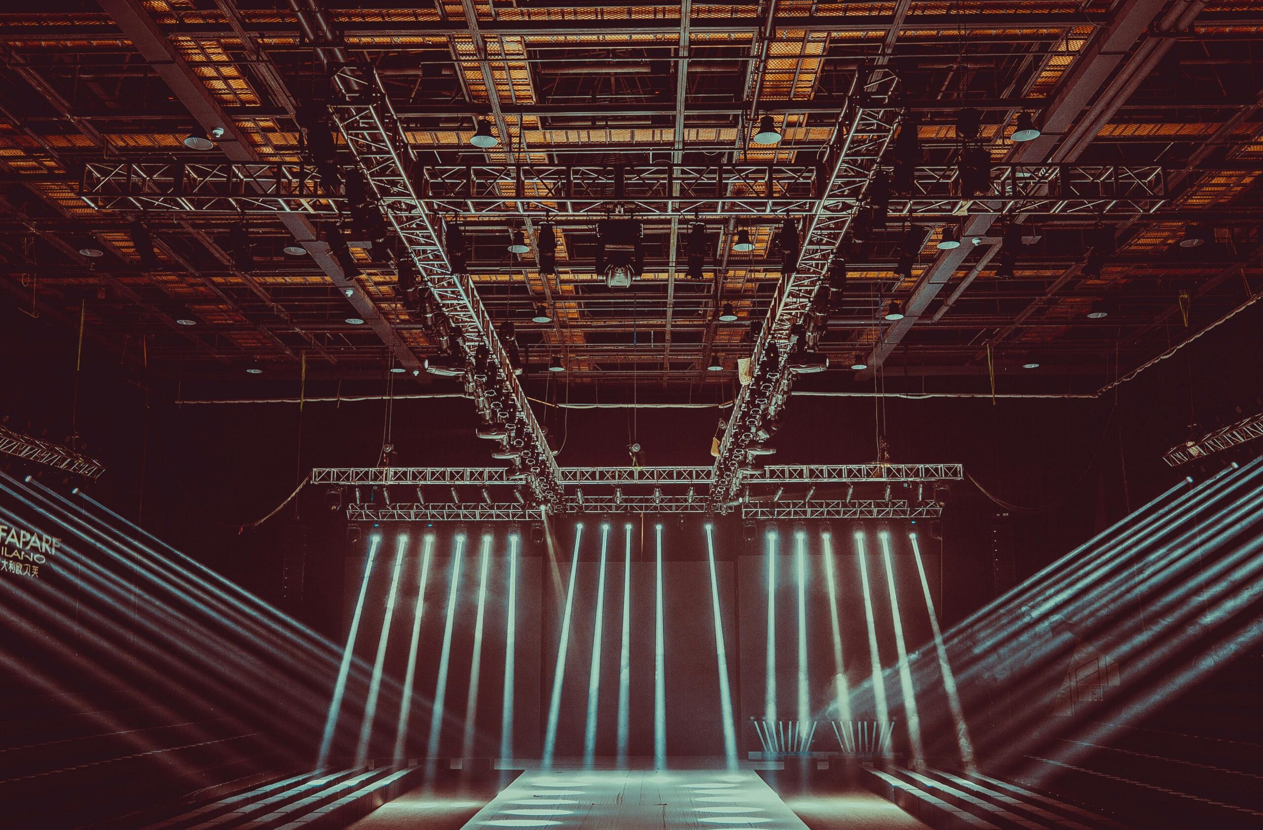 Lights illuminate a stage in a theater.