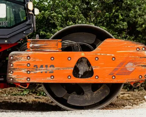 A construction roller prepares for repaving on a street or road.