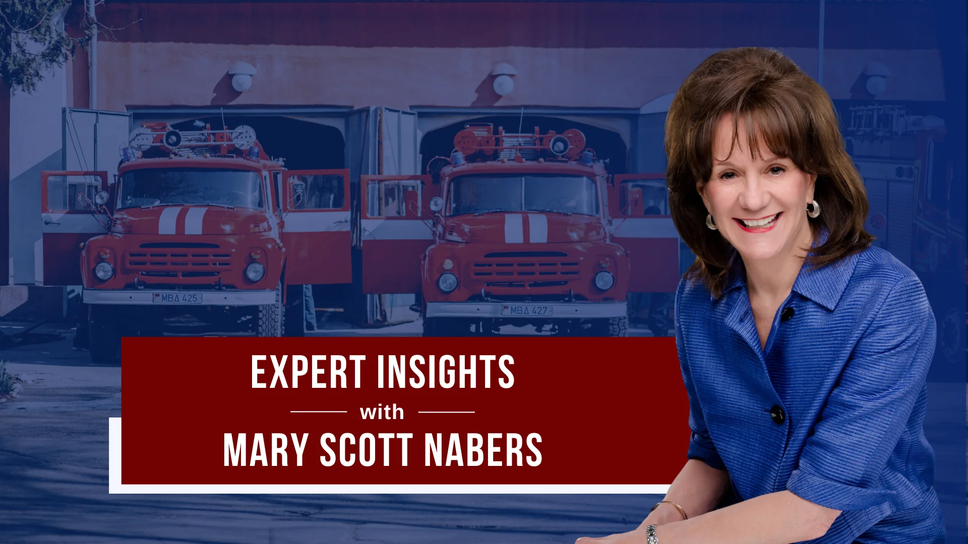 Mary Scott Nabers before fire trucks and a fire station for her weekly column.
