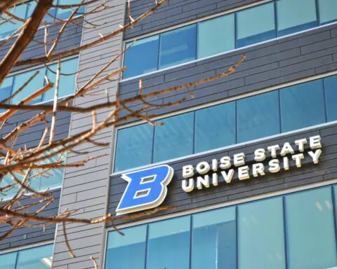 A Boise State University sign on the side of a modern building in Boise, Idaho.