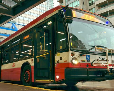 A bus sits at a station.