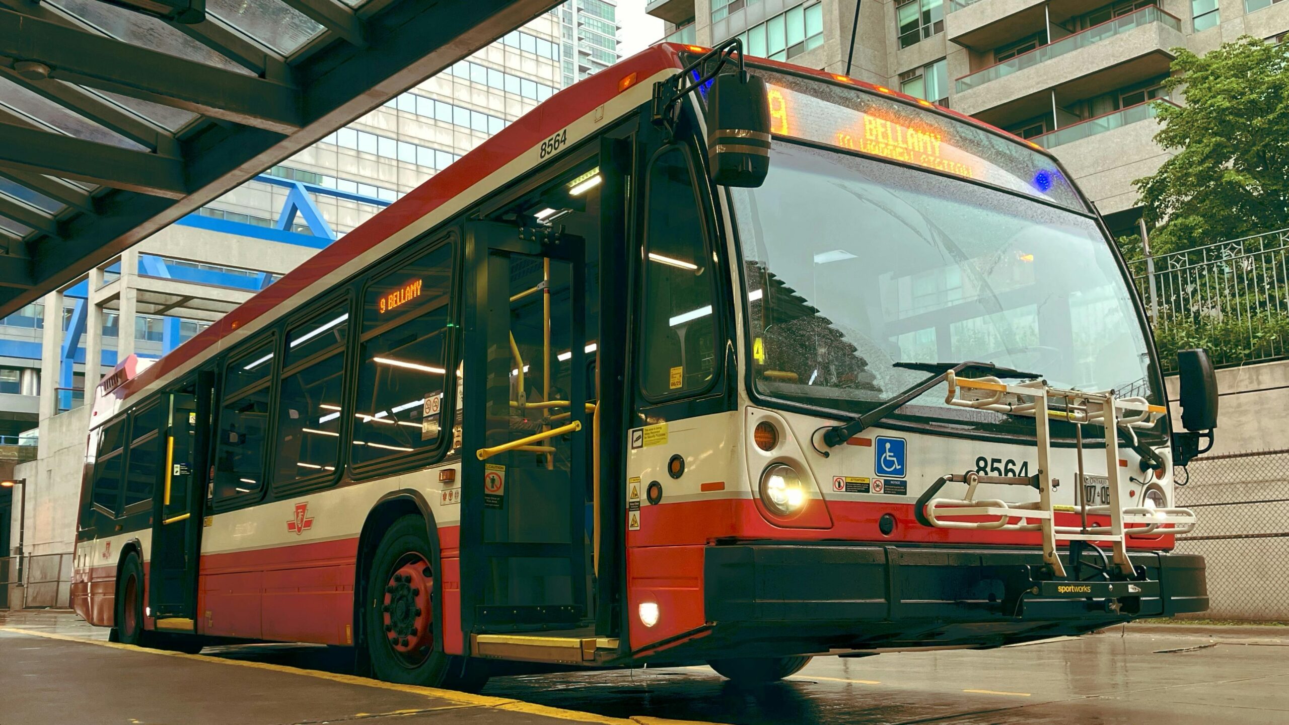 A bus sits at a station.
