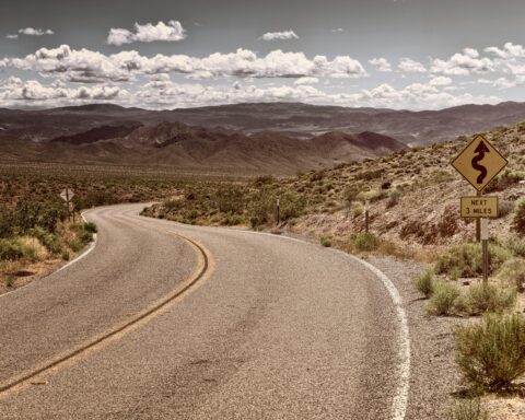 A stretch of Route 66 in California continuing through desert.