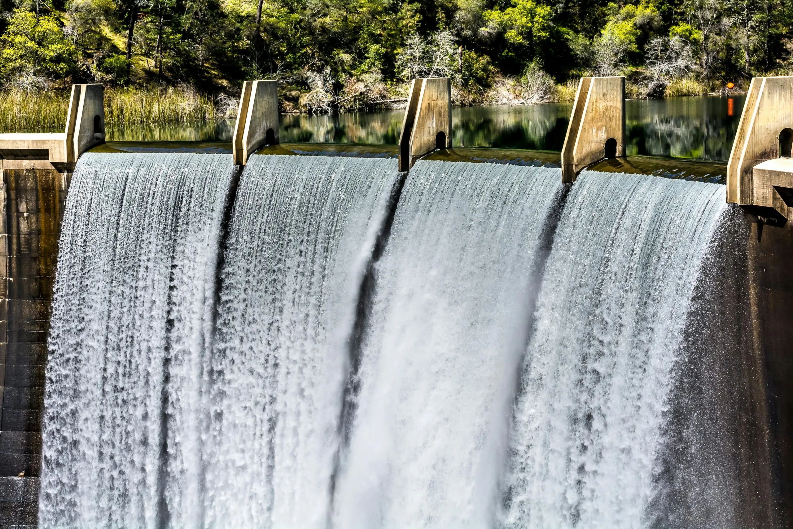 A reservoir pouring water down to a separate body in Auburn, California.