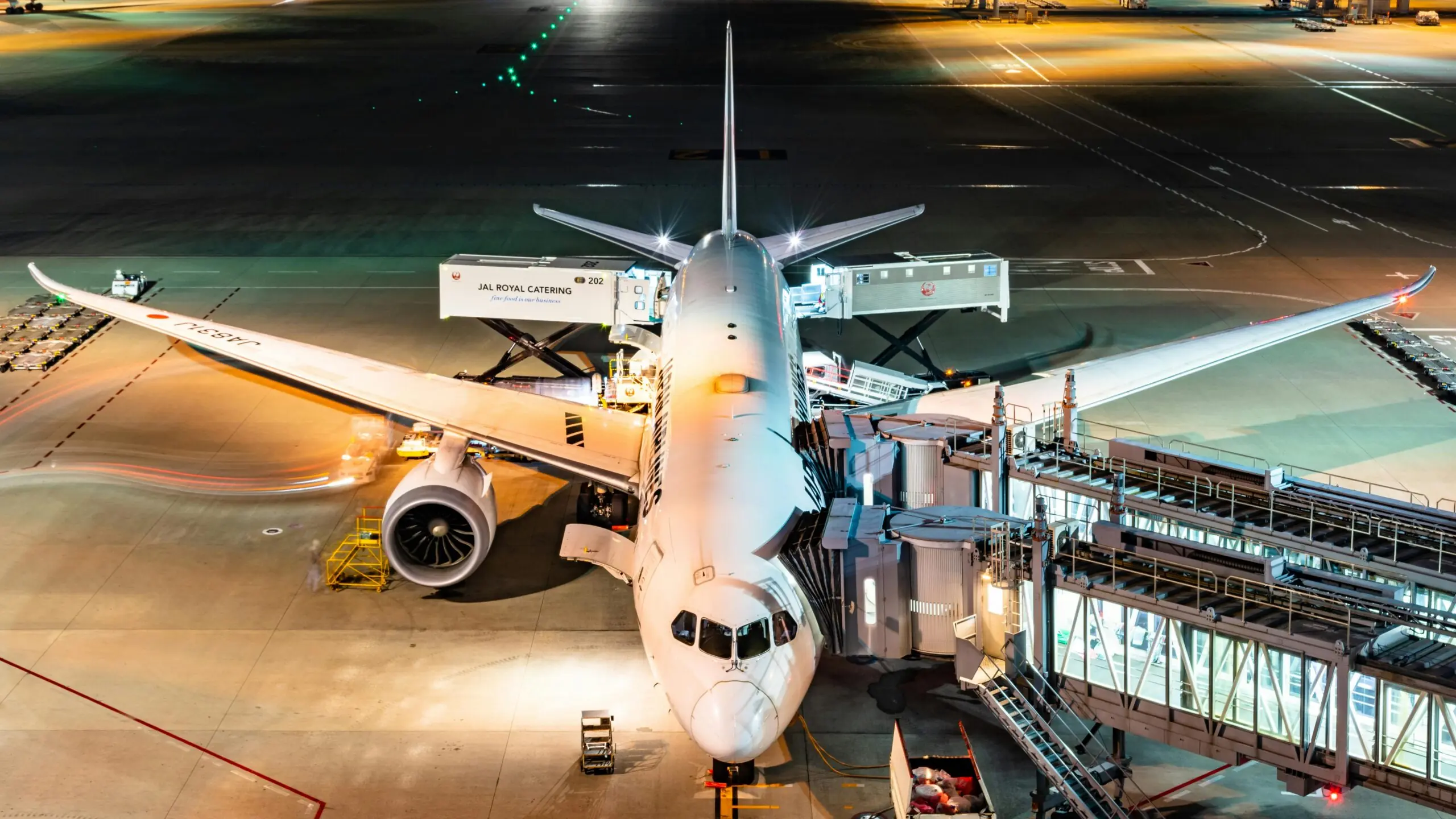 A plane prepares for boarding and takeoff at an airport.